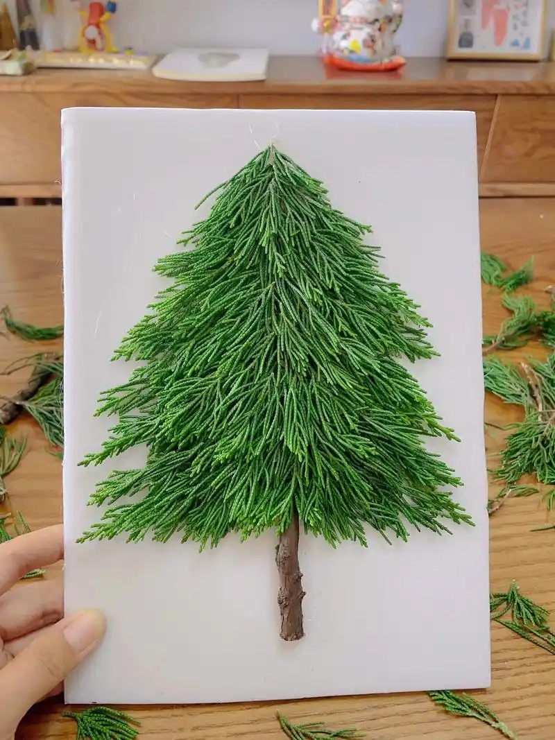 手工diy圣诞树90.再次改造了一下,把叶子向下做好后更像圣 - 抖音