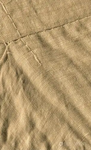 浅棕色的布料. 轻盈的天然亚麻纹理. 棕色帆布背景纹理