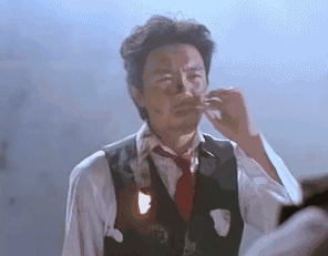 周星驰gif抽烟gif爆炸头gif吹灭gif