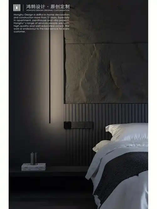 哑光木饰面以及黑色毛石,加上金属质感的灯光,营造出炫酷又温暖的