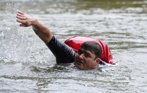 sick of congested roads, german man swims to work