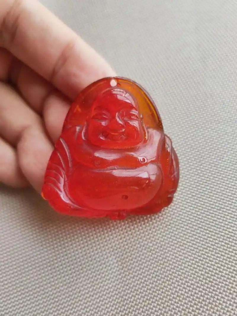 一颗红色老蜜蜡,求鉴定真伪的方法 在香港的时候买的,超过20年的老